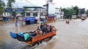 A supply truck transporting boats to flooded areas moves through a water-logged road in Aluva in Kerala.(REUTERS File Photo) A supply truck transporting boats to flooded areas moves through a water-logged road in Aluva in Kerala.(REUTERS File Photo)