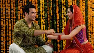 On Rakshabandhan, sisters tie rakhis around the wrist of the brother, signifying their affection towards him, and apply tilak on their forehead.(Shutterstock) On Rakshabandhan, sisters tie rakhis around the wrist of the brother, signifying their affection towards him, and apply tilak on their forehead.(Shutterstock)