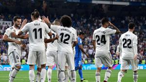 Real Madrid's Welsh forward Gareth Bale (2ndL) celebrates with teammates after scoring a goal during the Spanish League football match between Real Madrid and Getafe.(AFP) Real Madrid's Welsh forward Gareth Bale (2ndL) celebrates with teammates after scoring a goal during the Spanish League football match between Real Madrid and Getafe.(AFP)
