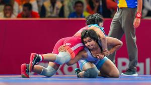India's Divya Kakran (blue) during her 68 kg freestyle wrestling match against Mongolia’s Tumentsetseg Sharkhuu at the Asian Games 2018.(PTI) India's Divya Kakran (blue) during her 68 kg freestyle wrestling match against Mongolia’s Tumentsetseg Sharkhuu at the Asian Games 2018.(PTI)