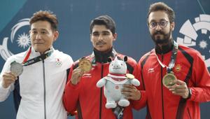 Saurabh Chaudhary (C) on Tuesday became only the fifth Indian shooter to claim a gold in the Asian Games history, beating a field of multiple world and Olympic champions in the 10m air pistol finals in Palembang, Indonesia.(AP) Saurabh Chaudhary (C) on Tuesday became only the fifth Indian shooter to claim a gold in the Asian Games history, beating a field of multiple world and Olympic champions in the 10m air pistol finals in Palembang, Indonesia.(AP)