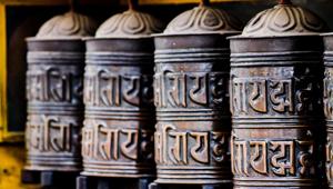A Tibetan prayer wheel in Swayambunath Temple. The text written in each wheel is in Sanskrit.(Shutterstock) A Tibetan prayer wheel in Swayambunath Temple. The text written in each wheel is in Sanskrit.(Shutterstock)
