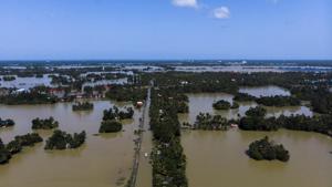 Trees submerged in floodwater in this aerial photograph taken in Kainakary village in the district of Alappuzha, Kerala, on Thursday.(Bloomberg) Trees submerged in floodwater in this aerial photograph taken in Kainakary village in the district of Alappuzha, Kerala, on Thursday.(Bloomberg)
