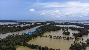 Trees and houses partially submerged in floodwaters in this aerial photograph taken in Kainakary village in the district of Alappuzha, Kerala, on August 23.(Bloomberg file photo)