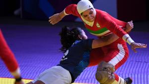 India's Kavita (L) tries to score as Iran's players defend during the women's team kabaddi finals match between India and Iran at the 2018 Asian Games in Jakarta on August 24, 2018.(AFP) India's Kavita (L) tries to score as Iran's players defend during the women's team kabaddi finals match between India and Iran at the 2018 Asian Games in Jakarta on August 24, 2018.(AFP)