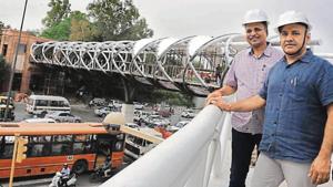 PWD minister Satyendra Jain and deputy CM Manish Sisodia inspect the skywalk.(Sonu Mehta/HT PHOTO) PWD minister Satyendra Jain and deputy CM Manish Sisodia inspect the skywalk.(Sonu Mehta/HT PHOTO)