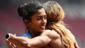 Bahrain's Oluwakemi Adekoya (R) hugs India's Anu Raghavan after competing in a heat at Asian Games 2018.(AFP) Bahrain's Oluwakemi Adekoya (R) hugs India's Anu Raghavan after competing in a heat at Asian Games 2018.(AFP)