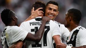 Juventus' Cristiano Ronaldo (2ndR) celebrates with his teammates during their Serie A match against Lazio.(AFP) Juventus' Cristiano Ronaldo (2ndR) celebrates with his teammates during their Serie A match against Lazio.(AFP)