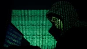 A hooded man holds a laptop computer as cyber code is projected on him in this illustration picture taken on May 13, 2017. REUTERS/Kacper Pempel/Illustration(REUTERS) A hooded man holds a laptop computer as cyber code is projected on him in this illustration picture taken on May 13, 2017. REUTERS/Kacper Pempel/Illustration(REUTERS)