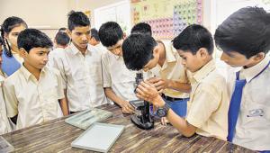 Students of Samarth Vidya Mandir observe a specimen through the microscope at their science lab, one of the few facilities provided in the school with the help of Alfa Laval and Rotary club which donated over Rs 40 lakh to build an eightroom school.(SANKET WANKHADE/HT PHOTO) Students of Samarth Vidya Mandir observe a specimen through the microscope at their science lab, one of the few facilities provided in the school with the help of Alfa Laval and Rotary club which donated over Rs 40 lakh to build an eightroom school.(SANKET WANKHADE/HT PHOTO)