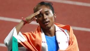 India's Hima Das celebrates after her second place finish in the women's 400m final during the athletics competition at the 18th Asian Games at Gelora Bung Karno Stadium.(AP)