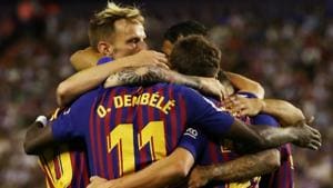 Barcelona's Ousmane Dembele celebrates with team mates after scoring their first goal against Real Valladolid.(REUTERS)