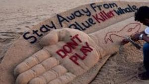 A sand sculpture with the message ‘Stay away from Blue Killer Whale : Don’t Play’.(PTI File Photo) A sand sculpture with the message ‘Stay away from Blue Killer Whale : Don’t Play’.(PTI File Photo)