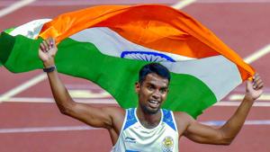 Jakarta: India's Ayyasamy Dharun celebrates with a Tricolour after winning the Silver medal in the men's 400m hurdles event at the 18th Asian Games 2018 in Jakarta, Indonesia on Monday, Aug 27, 2018.(PTI)