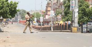 An armed policeman in Ramganj Bazar area of Jaipur after curfew was imposed following arson by mob and death of a civilian in clashes between police and the mob.(HT File Photo) An armed policeman in Ramganj Bazar area of Jaipur after curfew was imposed following arson by mob and death of a civilian in clashes between police and the mob.(HT File Photo)