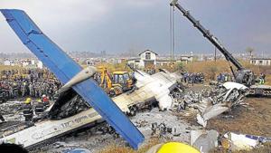 Rescue workers work at the wreckage of a US-Bangla airplane after it crashed at the Tribhuvan International Airport in Kathmandu.(Reuters File Photo) Rescue workers work at the wreckage of a US-Bangla airplane after it crashed at the Tribhuvan International Airport in Kathmandu.(Reuters File Photo)