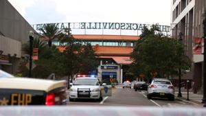 Police officers cordon off a street outside The Jacksonville Landing after a shooting during a video game tournament in Jacksonville, Florida on Sunday.(REUTERS) Police officers cordon off a street outside The Jacksonville Landing after a shooting during a video game tournament in Jacksonville, Florida on Sunday.(REUTERS)