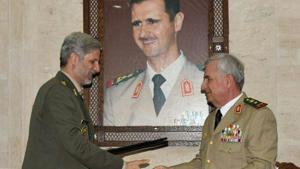 Iranian defence minister Amir Hatami (L) meeting with his Syrian counterpart Abdullah Ayoub (R) in the capital Damascus. Iran and Syria signed a deal for military cooperation in a meeting between the defence ministers of the two countries in Damascus, Iranian media reported on Monday.(AFP Photo) Iranian defence minister Amir Hatami (L) meeting with his Syrian counterpart Abdullah Ayoub (R) in the capital Damascus. Iran and Syria signed a deal for military cooperation in a meeting between the defence ministers of the two countries in Damascus, Iranian media reported on Monday.(AFP Photo)