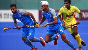 India's Manpreet Singh (left) and Mandeep Singh (center) vie for the ball with Sri Lanka's Mud I.K.J. Doranegala.(AP) India's Manpreet Singh (left) and Mandeep Singh (center) vie for the ball with Sri Lanka's Mud I.K.J. Doranegala.(AP)