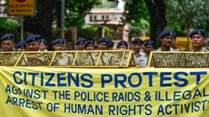 Delhi Police personnel stand on duty as activists from various organisations stage a protest pertaining to the arrest of five activists, in connection with the Bhima-Koregaon protests, in New Delhi on August 29.(PTI Photo) Delhi Police personnel stand on duty as activists from various organisations stage a protest pertaining to the arrest of five activists, in connection with the Bhima-Koregaon protests, in New Delhi on August 29.(PTI Photo)
