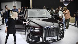 Visitors inspect a sedan version of Russian President Vladimir Putin's new Argus Senat limousine at the Moscow International Motor Show in Moscow on August 29, 2018.(AFP) Visitors inspect a sedan version of Russian President Vladimir Putin's new Argus Senat limousine at the Moscow International Motor Show in Moscow on August 29, 2018.(AFP)