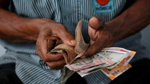 PM Modi’s decision to ban high-value currency notes, along with a chaotic introduction of the goods and services tax last year, acted as a drag on economic expansion with provisional data showing growth slumped to a four-year low of 6.6 percent in the fiscal year 2018.(Reuters File Photo) PM Modi’s decision to ban high-value currency notes, along with a chaotic introduction of the goods and services tax last year, acted as a drag on economic expansion with provisional data showing growth slumped to a four-year low of 6.6 percent in the fiscal year 2018.(Reuters File Photo)