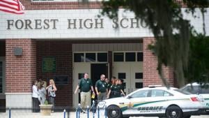 Marion County Police officers walk out Forest High School after a school shooting on April 20, 2018 in Ocala, Florida.(AFP File Photo) Marion County Police officers walk out Forest High School after a school shooting on April 20, 2018 in Ocala, Florida.(AFP File Photo)