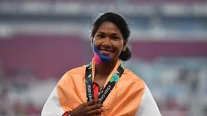 Gold medallist Swapna Barman of India celebrates during the medal ceremony for the women's hepatatlhon at the 2018 Asian Games in Jakarta on August 30, 2018. (Photo by Juni Kriswanto / AFP)(AFP) Gold medallist Swapna Barman of India celebrates during the medal ceremony for the women's hepatatlhon at the 2018 Asian Games in Jakarta on August 30, 2018. (Photo by Juni Kriswanto / AFP)(AFP)