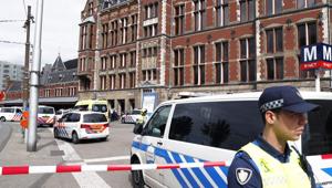 A security official stands beside a cordonned-off area at The Central Railway Station in Amsterdam on August 31, 2018, after two people were injured in a stabbing incidnet.(AFP) A security official stands beside a cordonned-off area at The Central Railway Station in Amsterdam on August 31, 2018, after two people were injured in a stabbing incidnet.(AFP)