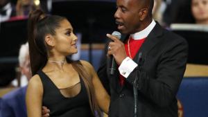 Bishop Charles H. Ellis, III, right, speaks with Ariana Grande after she performed during the funeral service for Aretha Franklin at Greater Grace Temple.(AP) Bishop Charles H. Ellis, III, right, speaks with Ariana Grande after she performed during the funeral service for Aretha Franklin at Greater Grace Temple.(AP)