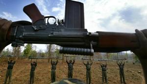 Maoist raise their arms during an exercise at a temporary base in the Abujh Marh forests, in Chhattisgarh.(AP File Photo) Maoist raise their arms during an exercise at a temporary base in the Abujh Marh forests, in Chhattisgarh.(AP File Photo)