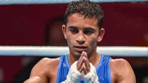 Jakarta: India's Amit Panghal gestures after he was declared winner against Paalam Carlo (unseen) of Philippines in the Men's Light Fly (46-49kg) boxing semifinal bout at the 18th Asian Games 2018 in Jakarta, Indonesia on Friday, Aug 31, 2018.(PTI) Jakarta: India's Amit Panghal gestures after he was declared winner against Paalam Carlo (unseen) of Philippines in the Men's Light Fly (46-49kg) boxing semifinal bout at the 18th Asian Games 2018 in Jakarta, Indonesia on Friday, Aug 31, 2018.(PTI)