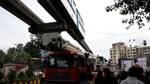 The fire brigade had to cut the cable wires when it got engulfed with a Monorail door on Sunday.(HT Photo) The fire brigade had to cut the cable wires when it got engulfed with a Monorail door on Sunday.(HT Photo)
