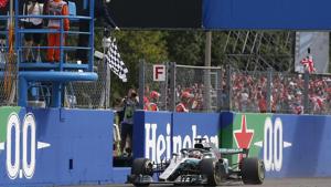 Checkered flag is waved as Mercedes driver Lewis Hamilton of Britain crosses the finish line during the Formula One Italy Grand Prix at the Monza racetrack, in Monza.(AP) Checkered flag is waved as Mercedes driver Lewis Hamilton of Britain crosses the finish line during the Formula One Italy Grand Prix at the Monza racetrack, in Monza.(AP)