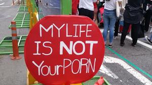 This picture taken on June 9, 2018 shows a red placard reading This picture taken on June 9, 2018 shows a red placard reading