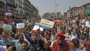 Kashmiri traders shout slogans during a protest against challenging the validity of Article 35A, in Lal Chowk, Srinagar on August 29.(Waseem Andrabi/HT Photo) Kashmiri traders shout slogans during a protest against challenging the validity of Article 35A, in Lal Chowk, Srinagar on August 29.(Waseem Andrabi/HT Photo)