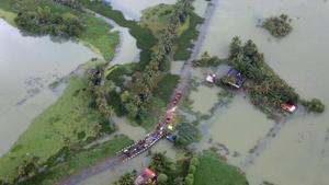 An aerial view shows partially submerged road at a flooded area in the southern state of Kerala on August 19.(REUTERS) An aerial view shows partially submerged road at a flooded area in the southern state of Kerala on August 19.(REUTERS)