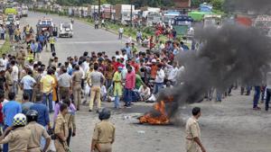 Several upper caste organisation activists raise slogans and burn tyres during Bharat Bandh protest called over SC/ST Amendment Act, in Varanasi, Thursday.(PTI Photo) Several upper caste organisation activists raise slogans and burn tyres during Bharat Bandh protest called over SC/ST Amendment Act, in Varanasi, Thursday.(PTI Photo)