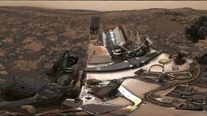 This composite image made available by Nasa shows the Curiosity rover at Vera Rubin Ridge on Mars. A thin layer of dust is visible on the nuclear-powered rover, the result of a storm that enveloped the planet this summer. The darkish sky is from dust still in the atmosphere.(AP File Photo) This composite image made available by Nasa shows the Curiosity rover at Vera Rubin Ridge on Mars. A thin layer of dust is visible on the nuclear-powered rover, the result of a storm that enveloped the planet this summer. The darkish sky is from dust still in the atmosphere.(AP File Photo)