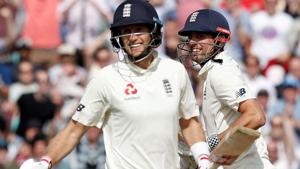 England's Joe Root (L) and Alastair Cook in action during the fifth Test match against India.(AFP)