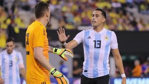 Argentina goalkeeper Franco Armani is congratulated by teamamte Ramiro Funes Mori after Armani made a stop in the first half against Colombia.(AFP) Argentina goalkeeper Franco Armani is congratulated by teamamte Ramiro Funes Mori after Armani made a stop in the first half against Colombia.(AFP)
