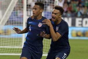 United States midfielder Tyler Adams (4) celebrates with defender Antonee Robinson after scoring a goal against Mexico.(USA TODAY Sports) United States midfielder Tyler Adams (4) celebrates with defender Antonee Robinson after scoring a goal against Mexico.(USA TODAY Sports)