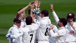 AFP Image(File image of Surrey cricket team celebrating the fall of a wicket.) AFP Image(File image of Surrey cricket team celebrating the fall of a wicket.)