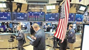 Traders work on the floor at the opening bell of the Dow Industrial Average at the New York Stock Exchange on August 22, 2018 in New York(AFP) Traders work on the floor at the opening bell of the Dow Industrial Average at the New York Stock Exchange on August 22, 2018 in New York(AFP)