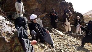 (In this photograph taken January 23, 2010, Taliban fighters pose during a patrol in Ghazni province of Afghanistan.(AFP File Photo) (In this photograph taken January 23, 2010, Taliban fighters pose during a patrol in Ghazni province of Afghanistan.(AFP File Photo)