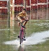 Come rain or shine: The joy of cycling.(NurPhoto via Getty Images)
