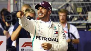 Lewis Hamilton reacts after winning the pole position during the qualifying session ahead of the Singapore Grand Prix.(AFP) Lewis Hamilton reacts after winning the pole position during the qualifying session ahead of the Singapore Grand Prix.(AFP)
