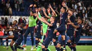 Paris Saint-Germain's players celebrate after winning the French L1 football match against Saint-Etienne (ASSE) at the Parc des Princes stadium in Paris.(AFP) Paris Saint-Germain's players celebrate after winning the French L1 football match against Saint-Etienne (ASSE) at the Parc des Princes stadium in Paris.(AFP)