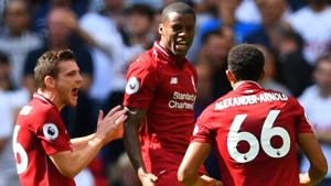 Liverpool's Georginio Wijnaldum celebrates scoring their first goal with Andrew Robertson and Trent Alexander-Arnold.(REUTERS)