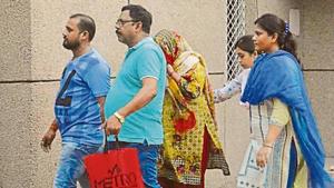 Yadav Singh’s wife Kusum Lata (face hidden) appeared before a CBI court after orders from the Supreme Court.(HT Photo) Yadav Singh’s wife Kusum Lata (face hidden) appeared before a CBI court after orders from the Supreme Court.(HT Photo)